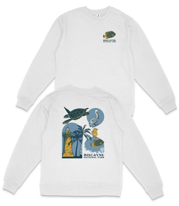 a white sweatshirt with a graphic design on the back, depicting various marine life and coastal elements such as a lighthouse, palm tree, and fish.