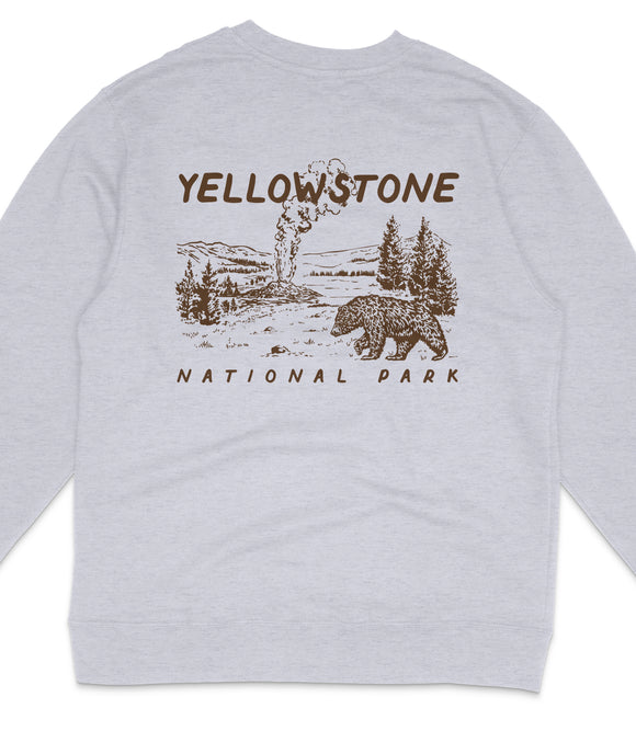 A gray sweatshirt with a graphic design depicting a bear and a landscape with a geyser, along with the text "Yellowstone National Park".