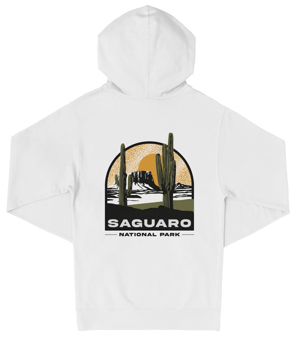 A white hooded sweatshirt with a graphic design depicting a desert landscape with a cactus and mountains in the background, along with the text "Saguaro National Park".