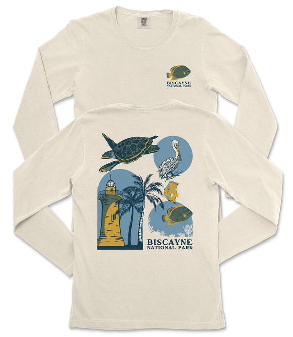 a white long-sleeved t-shirt with a graphic design depicting various marine life and landmarks, including a lighthouse, a turtle, a bird, and a palm tree.