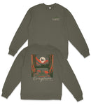 a gray sweatshirt with a graphic design on the back, depicting a scenic landscape with a lake, trees, and a bird flying over the water.