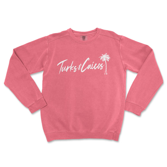 a pink sweatshirt with a palm tree on it
