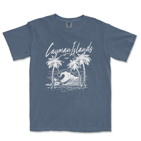 a blue t - shirt with a picture of a surfboarder riding a wave