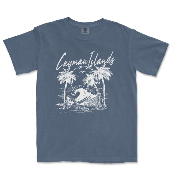 a blue t - shirt with a picture of a surfboarder riding a wave