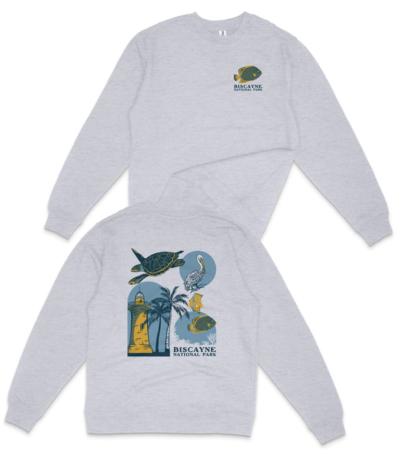 A grey sweatshirt with a graphic design featuring a turtle, palm trees, and a lighthouse, along with the text "BISCAYNE NATIONAL PARK".
