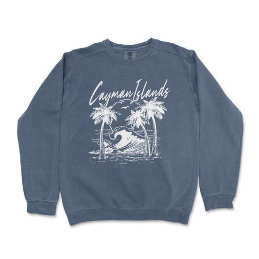 a blue sweatshirt with a picture of a wave and palm trees