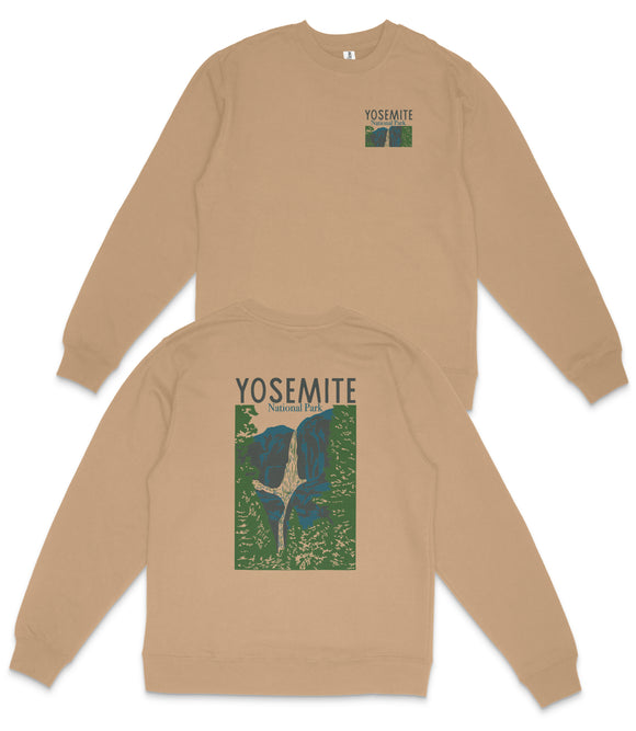 a beige sweatshirt with a graphic design on the back, depicting a waterfall surrounded by trees. The design includes the text "YOSEMITE" and "NATIONAL PARK".