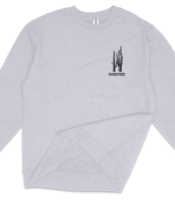 A gray long-sleeved shirt with a graphic design on the front, depicting a cactus plant.