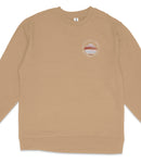A beige long-sleeved shirt with a round logo on the left side.