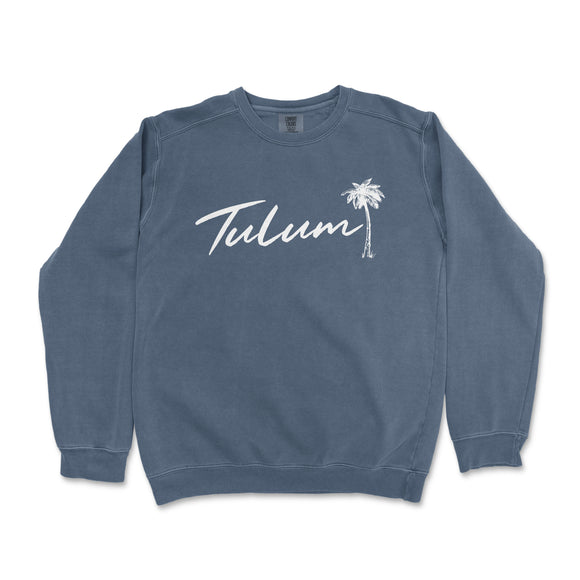 a blue sweatshirt with the word tulum written in white