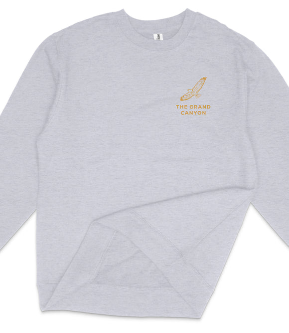 A gray sweatshirt with a logo on the left side.