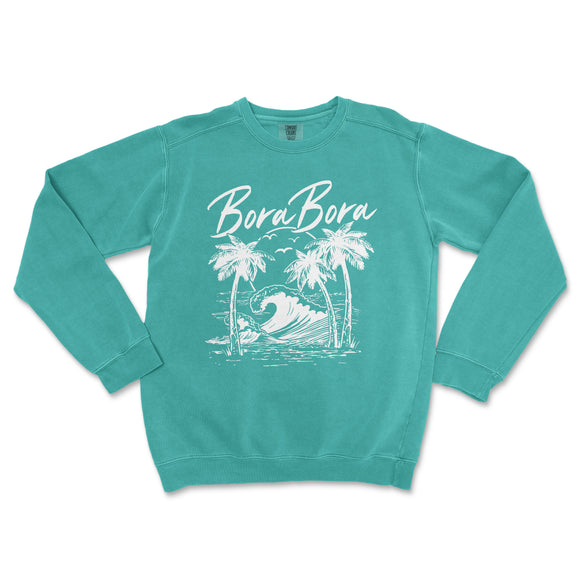 a turquoise sweatshirt with a surfboard and palm trees