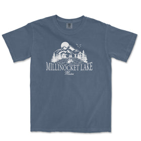 a blue t - shirt with a lake and mountains in the background