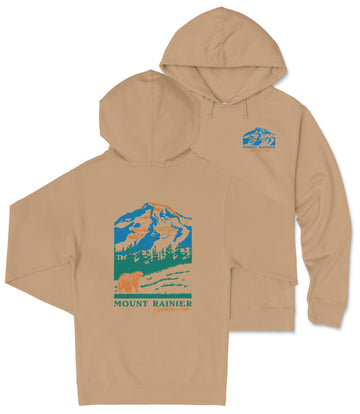 A beige hoodie with a graphic design depicting a mountain landscape and a bear.