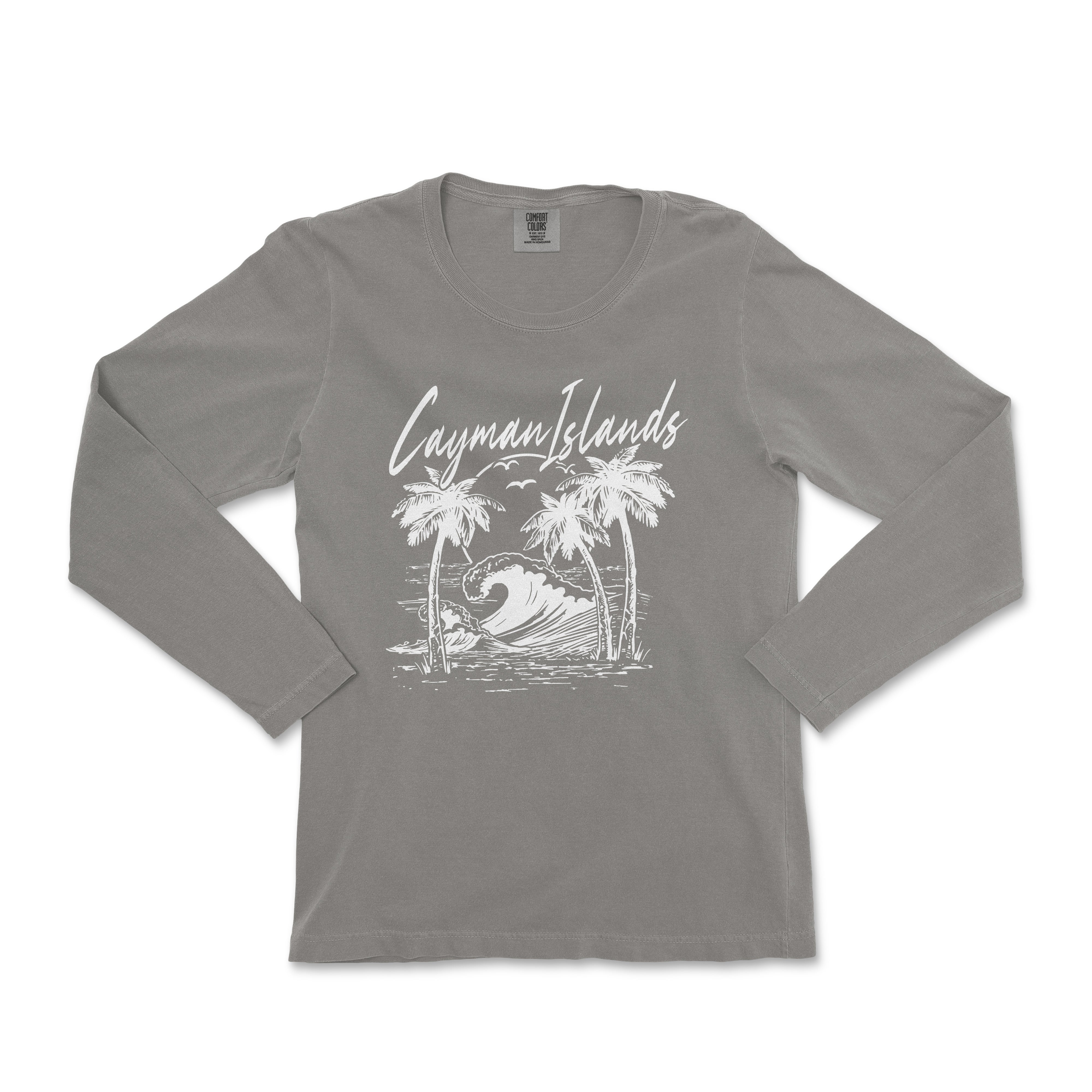 a women's long sleeve shirt with a graphic of a surfer riding a wave