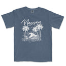 a blue t - shirt with a picture of a wave and palm trees