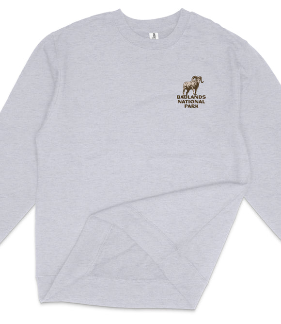 A gray long-sleeved shirt with a logo on the left side.
