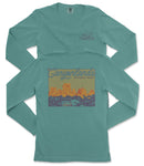 A turquoise long-sleeved t-shirt with a graphic design depicting a scenic landscape, specifically the Canylands National Park.