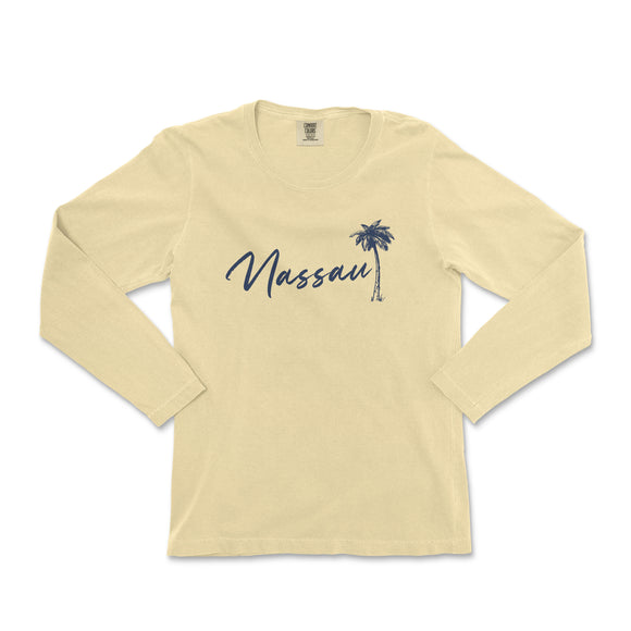 a women's long sleeve shirt with a palm tree in the background