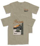 a beige t-shirt with a graphic design depicting a scenic landscape with mountains, a lake, and a canoe. The text on the t-shirt reads "Jasper National Park" and "National Park".