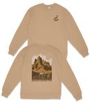 a tan sweatshirt with a graphic design depicting a mountain landscape and a horse.