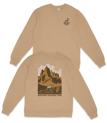 a tan sweatshirt with a graphic design depicting a mountain landscape and a horse.