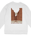 A white sweatshirt with a graphic design depicting a canyon landscape with a boat in the foreground, and the text "BIG BEND NATIONAL PARK" printed below.