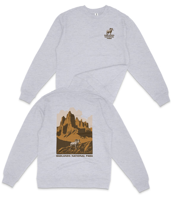 A gray sweatshirt with a graphic design depicting a mountain landscape and the text "RADLANDS NATIONAL PARK" printed on the back.