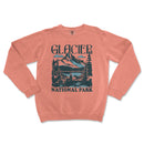 a pink sweater with a mountain scene on it