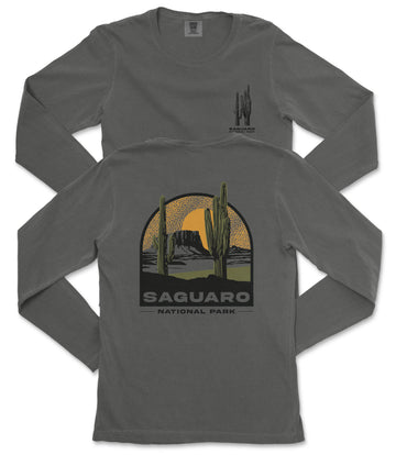 a gray long-sleeved t-shirt with a graphic design depicting a desert landscape with cacti and mountains, along with the text "Saguaro National Park".