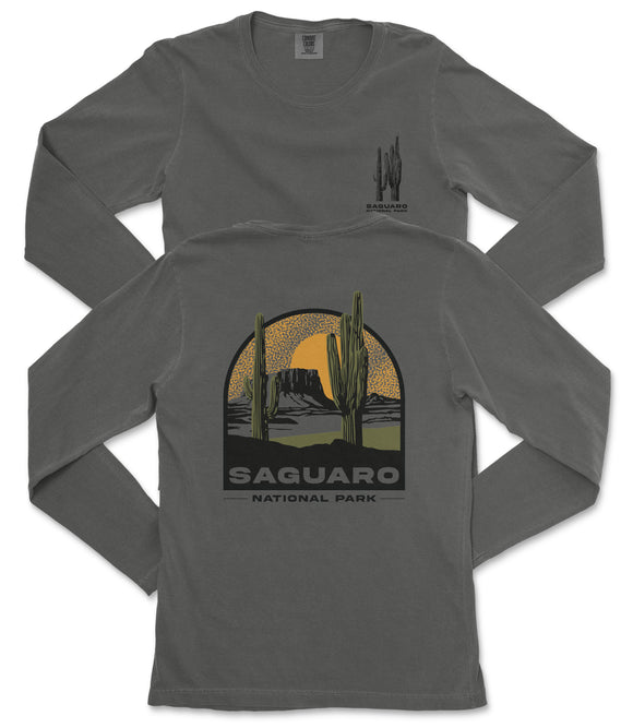 a gray long-sleeved t-shirt with a graphic design depicting a desert landscape with cacti and mountains, along with the text "Saguaro National Park".