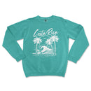 a turquoise sweatshirt with a palm tree and a surfboard on it