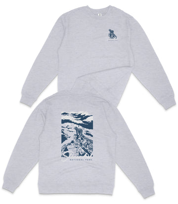 A grey long-sleeved shirt with a graphic design on the back, depicting a mountain landscape with a person riding a horse.