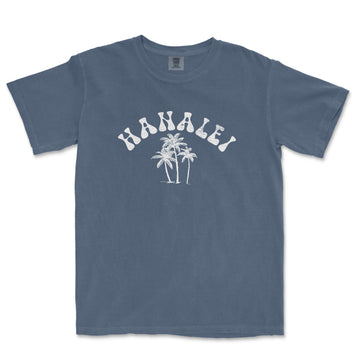 a blue t - shirt with a palm tree on it