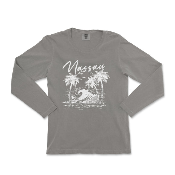 a women's long sleeve shirt with a picture of a surfer on a wave