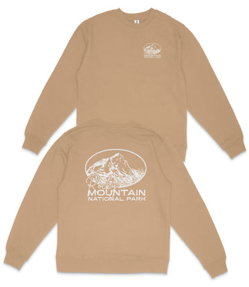 a beige sweatshirt with a graphic design and text on the back.