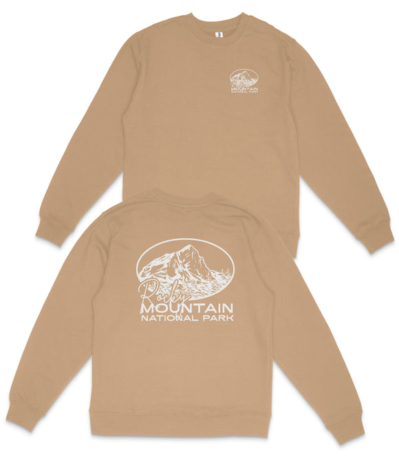 a beige sweatshirt with a graphic design and text on the back.