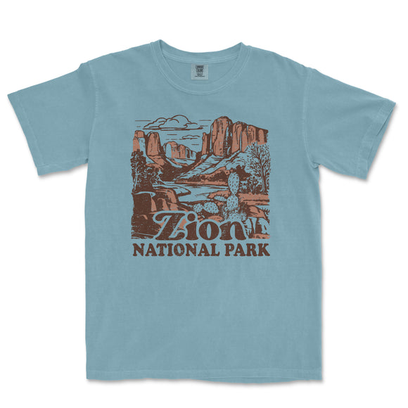 a blue t - shirt with a picture of the national park