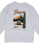 A gray sweatshirt with a graphic design depicting a scenic landscape with mountains, pine trees, and a lake, along with the text "Jasper National Park".