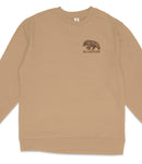 A beige long-sleeved shirt with a black bear illustration and the word "Yellowstone" printed on the front.