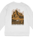 A white sweatshirt with a graphic design depicting a mountain landscape with a bighorn sheep in the foreground.