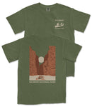 A green t-shirt with a graphic design depicting a canyon landscape and a boat on a river, along with the text "BIG BEND NATIONAL PARK".