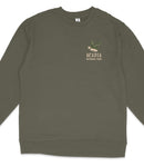 A dark green long-sleeved shirt with a graphic design on the left side, depicting a bird and the text "ACADIA NATIONAL PARK".