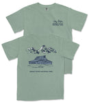 A green t-shirt with a graphic design depicting a cabin and mountains, along with the text "Grand Teton National Park".