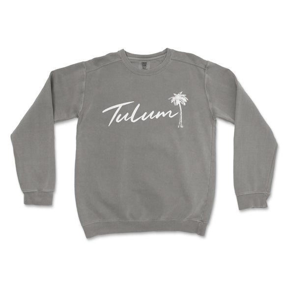 a grey sweatshirt with the word tulum written in white