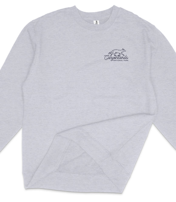A gray long-sleeved shirt with a logo on the left side.