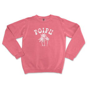 a pink sweatshirt with palm trees printed on it