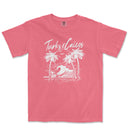 a pink t - shirt with a picture of a wave and palm trees