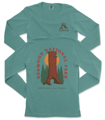 A long-sleeved teal-colored t-shirt with a graphic design featuring a redwood tree and the text "REDWOOD NATIONAL PARK NORTHERN CALIFORNIA".