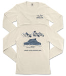 a cream-colored long-sleeved t-shirt with a graphic design depicting a cabin and mountains, along with the text "Grand Teton National Park" printed on the back.